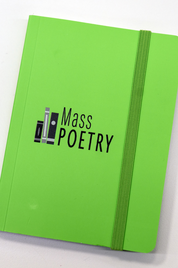 neon green journal with mass poetry logo on the front