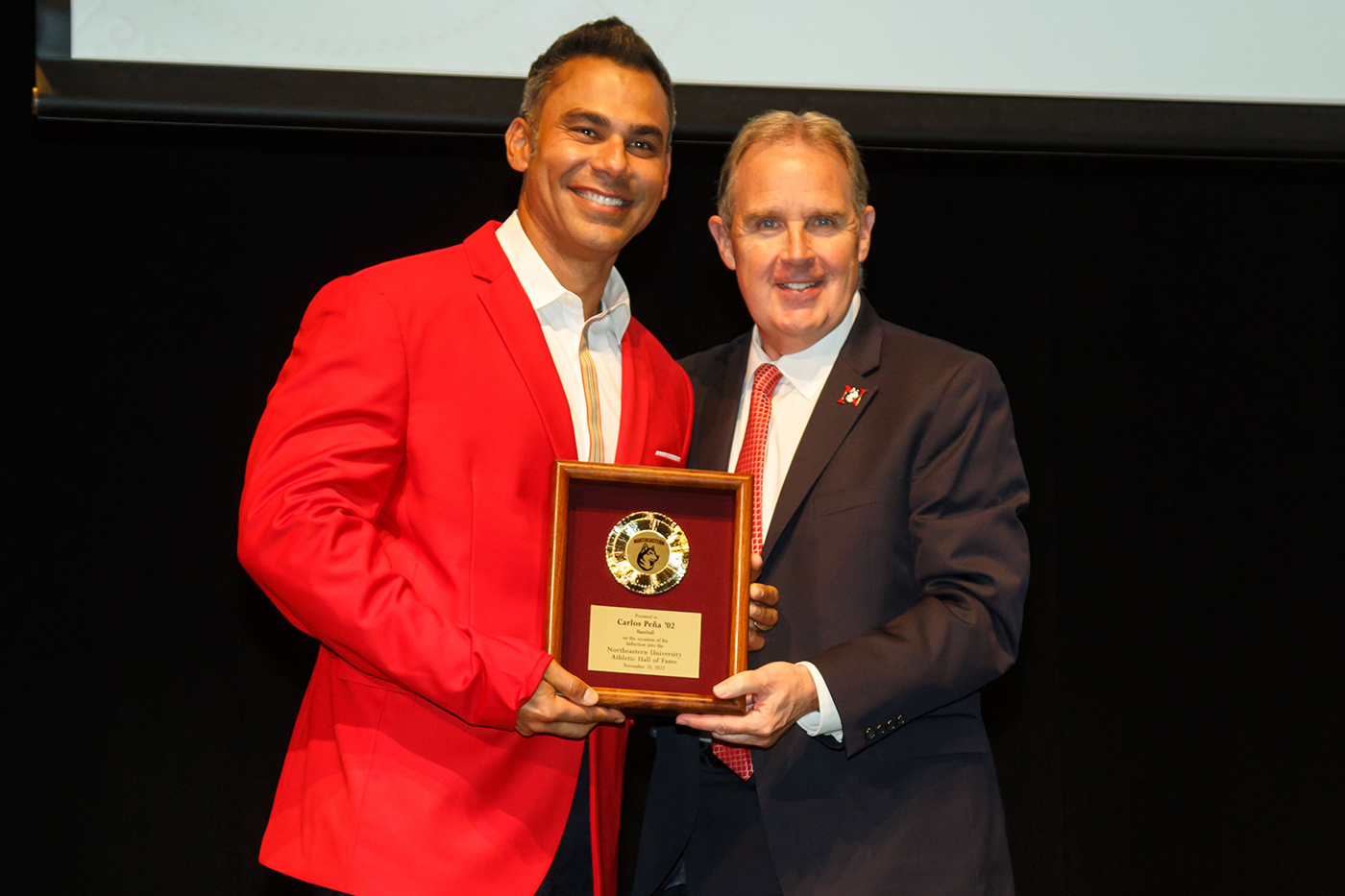 jim madigan posing with inductee