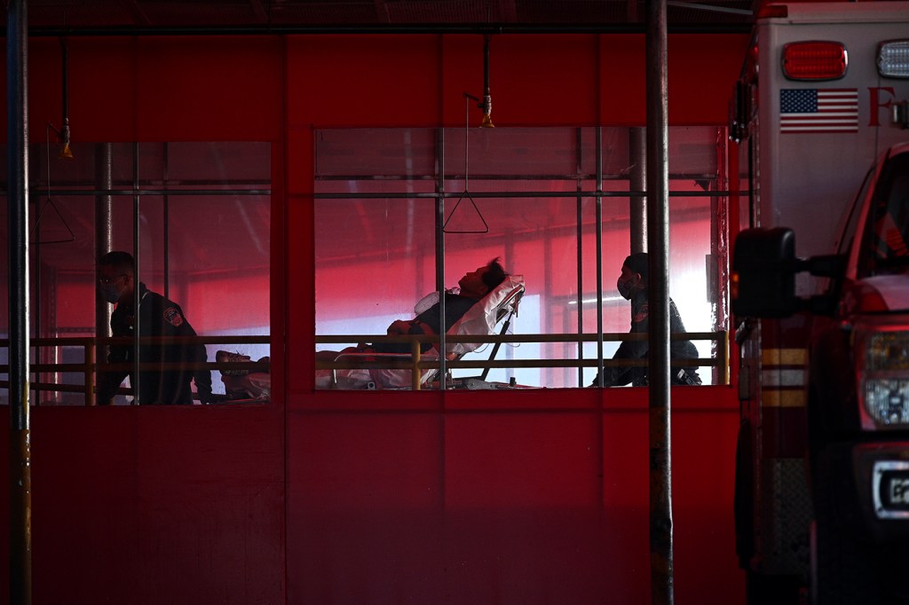people pushing stretcher in hospital