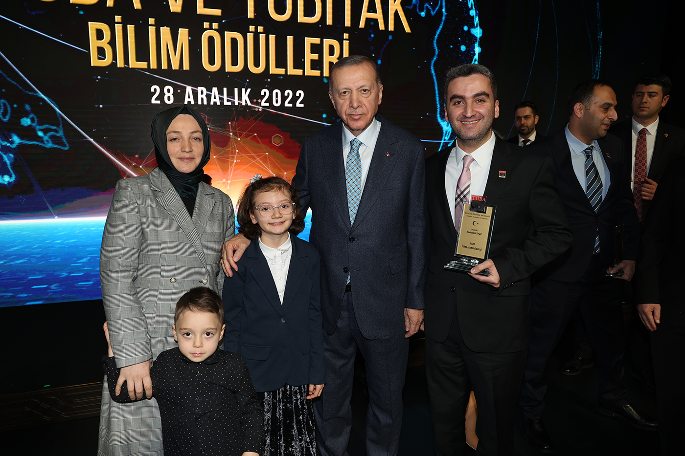Abdullah Tirgil posing with a group of people