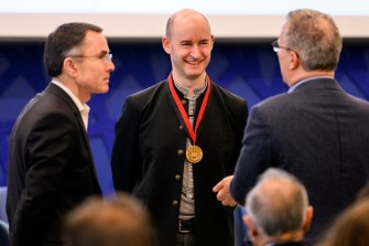 Christo Wilson honored with a medal around his neck