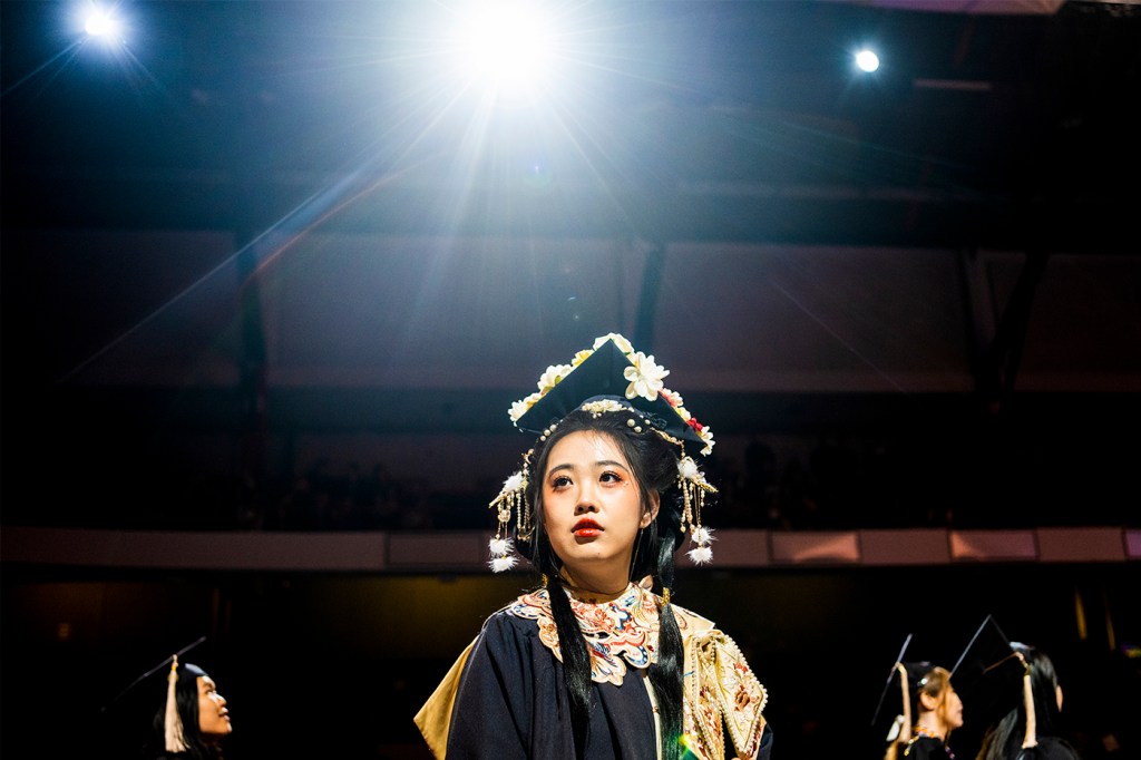 Meng Han wearing a decorated mortarboard