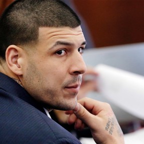 Aaron Hernandez looking over his shoulder while sitting in court.