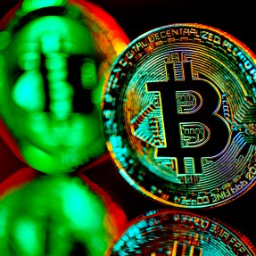 An image of Bitcoin on a dark background.