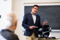 A professor speaks during a panel with alumni and entrepreneurs from startup program.
