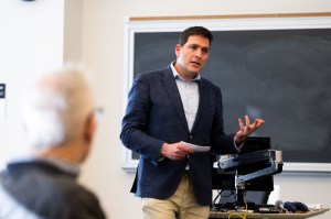 A professor speaks during a panel with alumni and entrepreneurs from startup program.