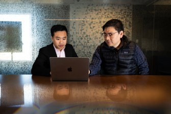 Portrait of doctoral student Anh Nguyen and physics professor Max Bi.