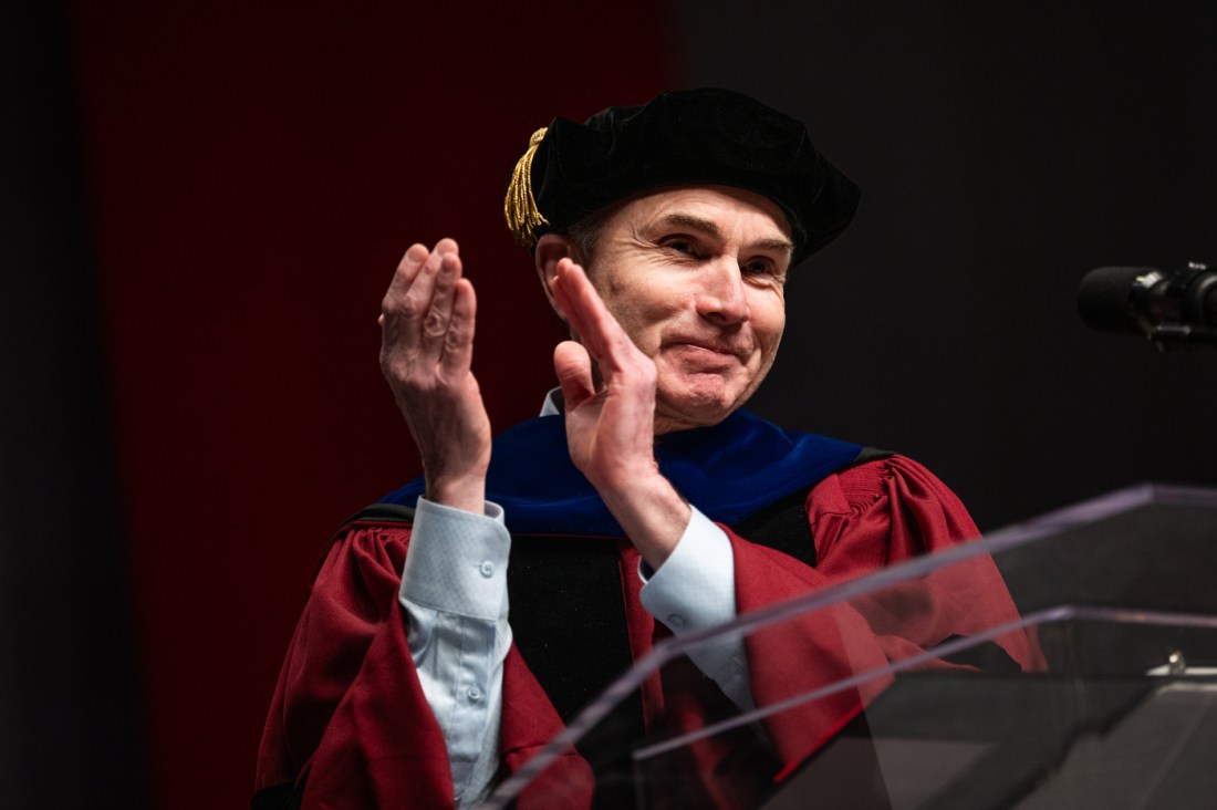David Madigan clapping at the PhD hooding and commencement ceremony.
