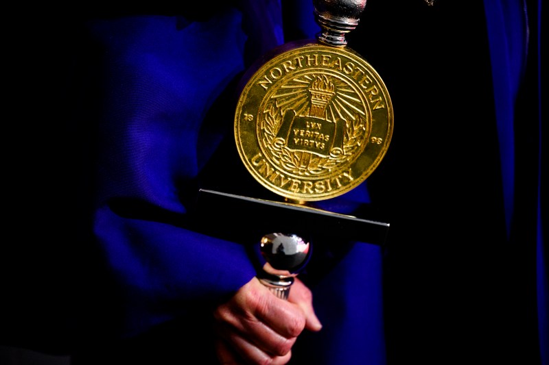 Gold Northeastern branded regalia.