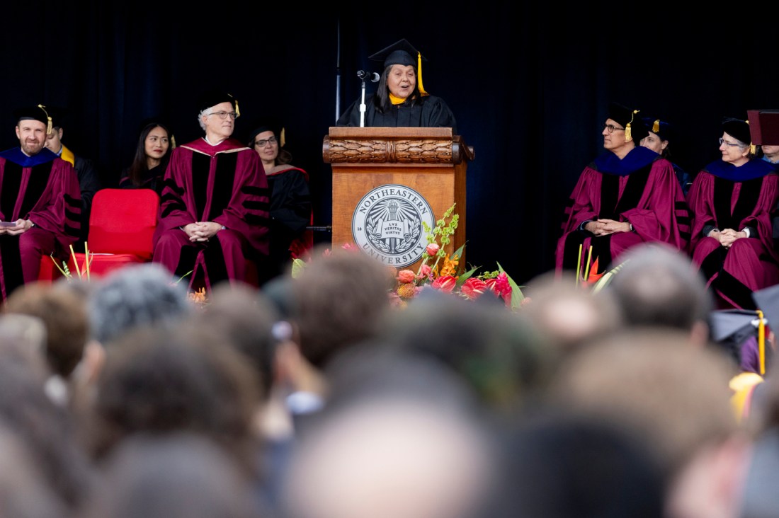 Diane R. Gonzalez speaking on stage at the Oakland commencement.