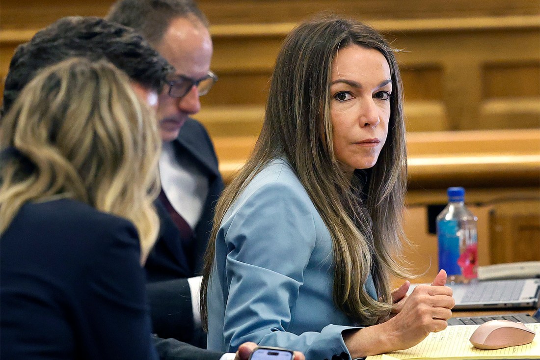Karen Read sits at the defense table during her murder trial, where digital forensics and cellphone evidence are central to the case.
