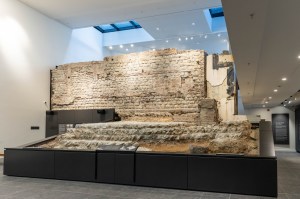 A section of a Roman wall inside of a building.