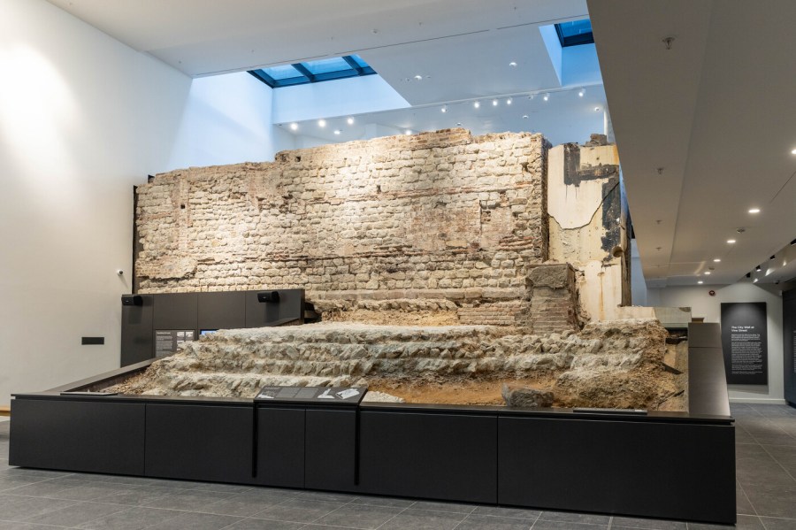 A section of a Roman wall inside of a building.