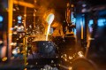 Close up of work with liquid hot metal.