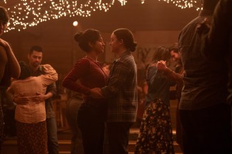 A screen capture of two characters facing each other and dancing in The Last of Us.