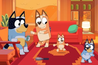 A screen capture of the cartoon dogs in a living room from the TV show 'Bluey'.