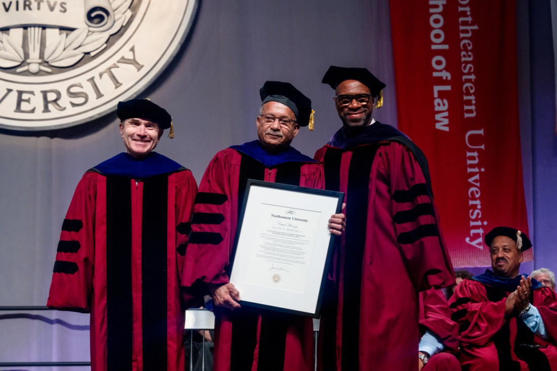 Ralph Martin posing with a large certificate next to David Madigan and James Hackney.