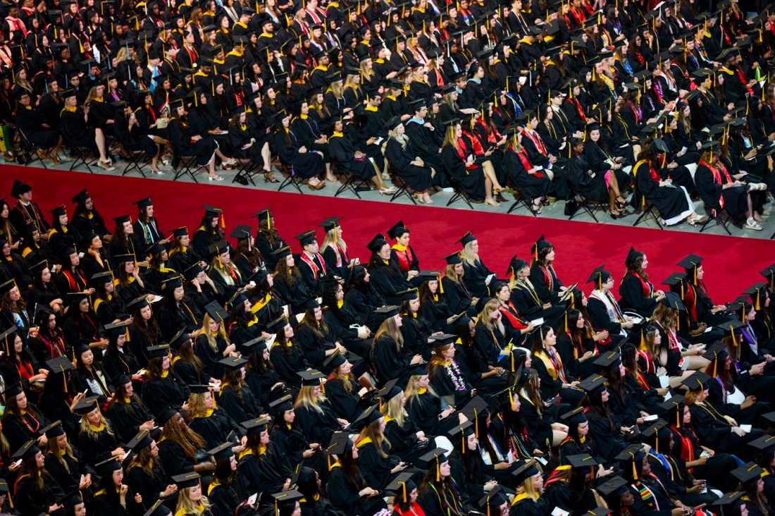 Graduates seated at Matthews Arena during the Bouve College of Health Sciences commencement ceremony.