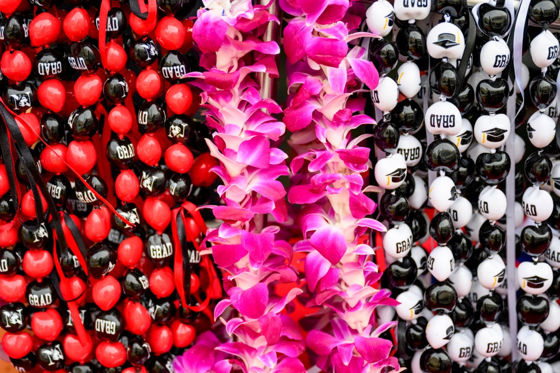 Grad branded leis and necklaces for sale.