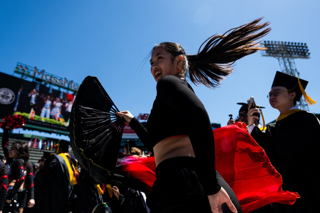 Graduate walk during the procession at the Graduate Commencement ceremony at Fenway Park.