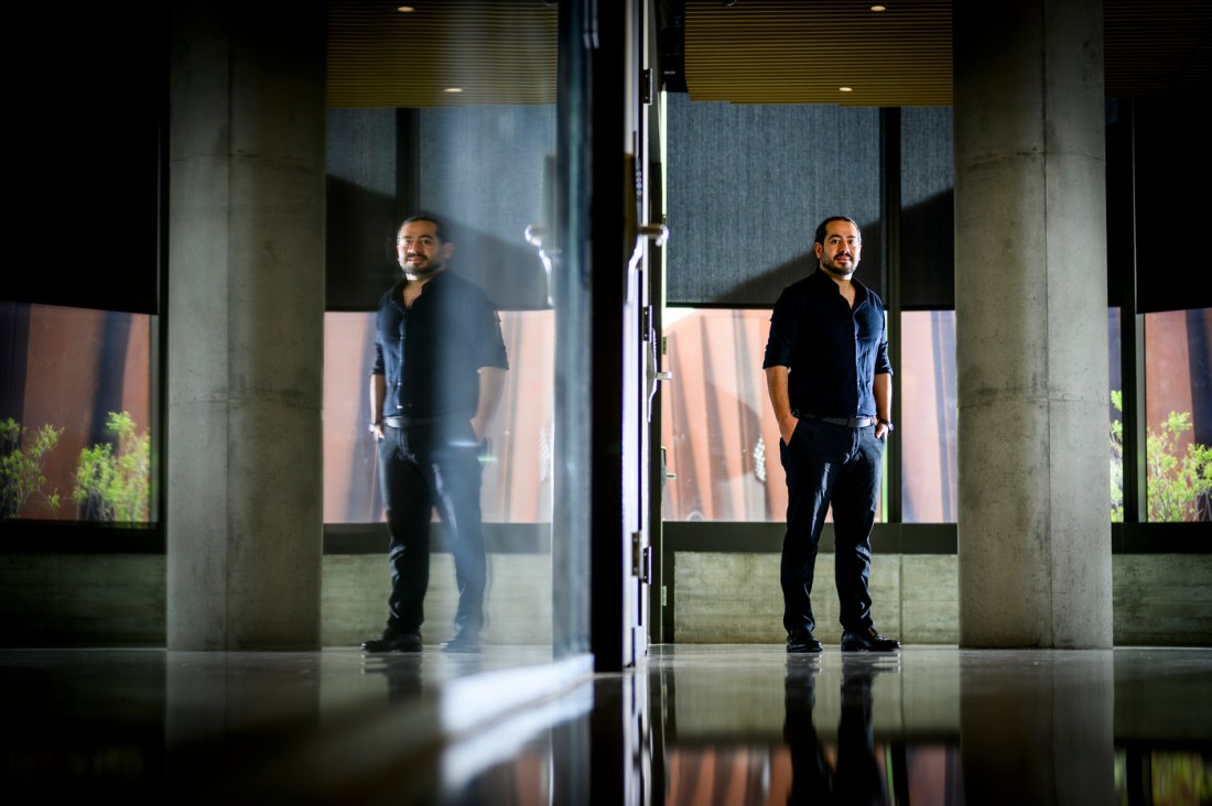 Safa Jamali standing inside a hallway.