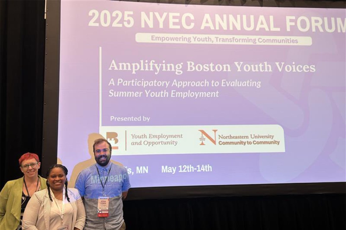 Three people stand in front of a large presentation screen at the 2025 NYEC Annual Forum in Minneapolis. The slide reads “Amplifying Boston Youth Voices” and features Northeastern’s Community to Community logo.