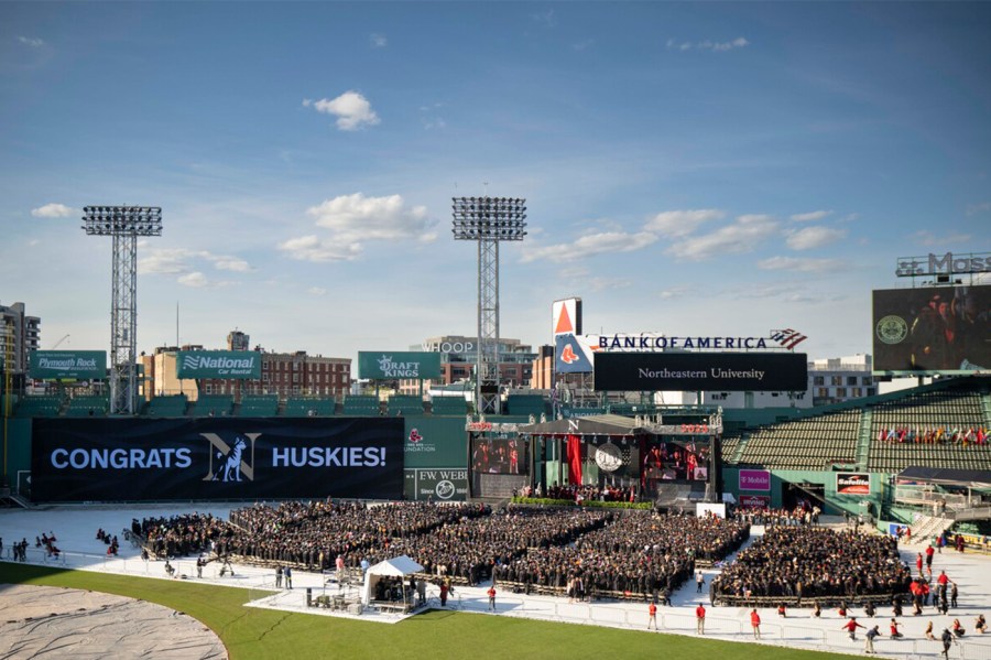 Graduates inside of Fenway Park for Commencement.