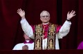 Pope Robert Francis Prevost Leo XIV greets the crowd from the balcony of St. Peter’s Basilica after his election in Vatican City.