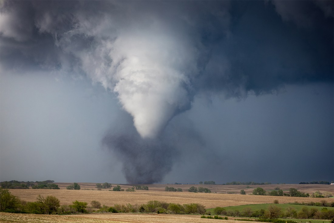 A large tornado swirling in the sky in Kansas.