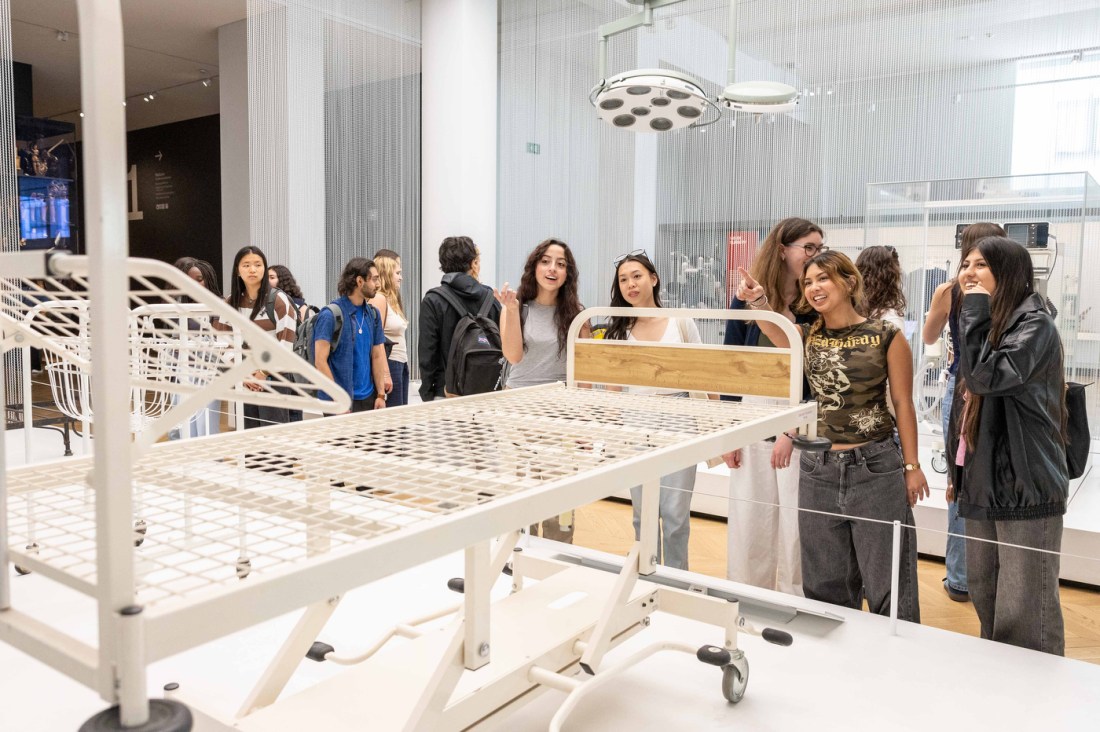 Students from the Dialogues of Civilization healthcare program examine medical equipment displays at the Science Museum in London.