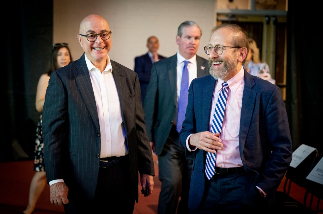 President speaks with attendees before a conference session on lifelong learning and AI.