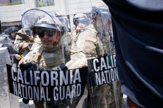 Federal law enforcement shown in tactical gear.