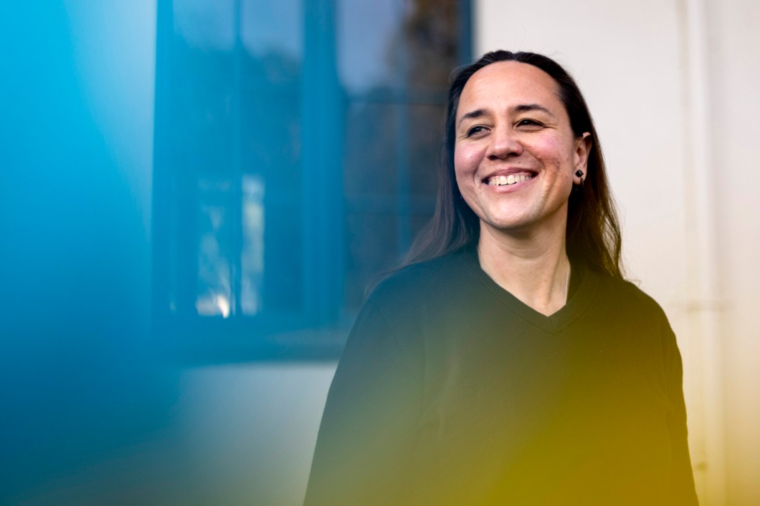 Portrait of Natalee Kēhaulani Bauer, smiling, outside.
