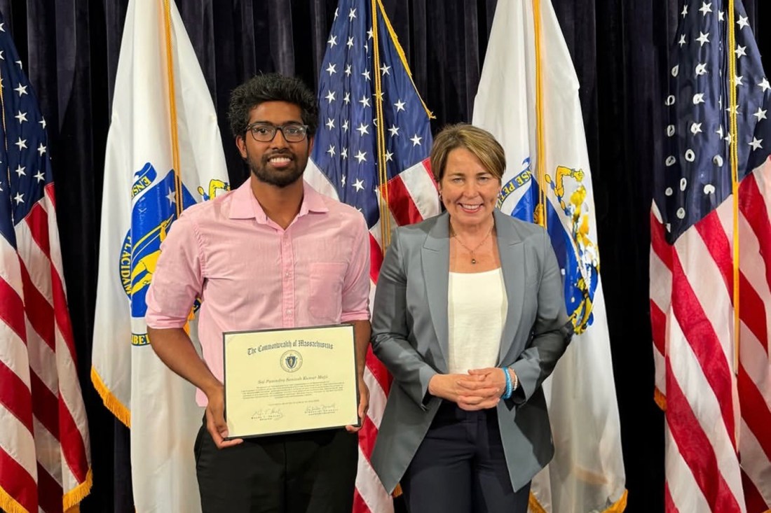 Sai Panindra Santosh Kumar Majji posing with Governor Maura Healy.