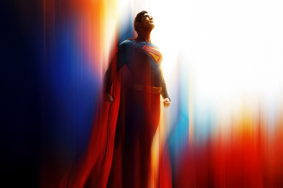 A screen capture from a 'Superman' movie that shoes the superhero shooting upwards into the sky with his signature suit and cape on.