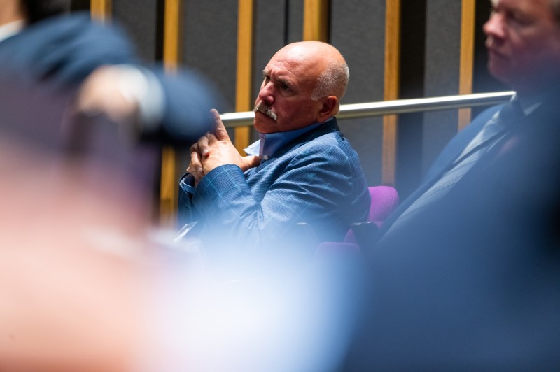 An attendee listens intently during Northeastern University’s Senior Leadership Retreat in the ISEC auditorium.
