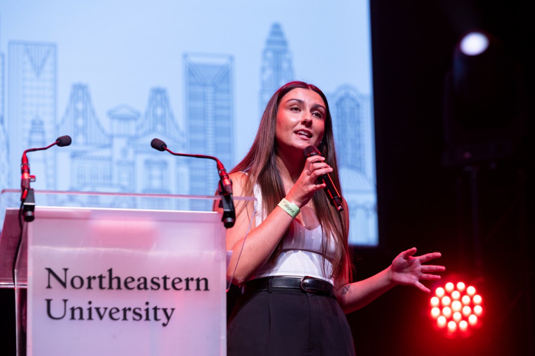 A female speaker addressing students during the London Convocation.
