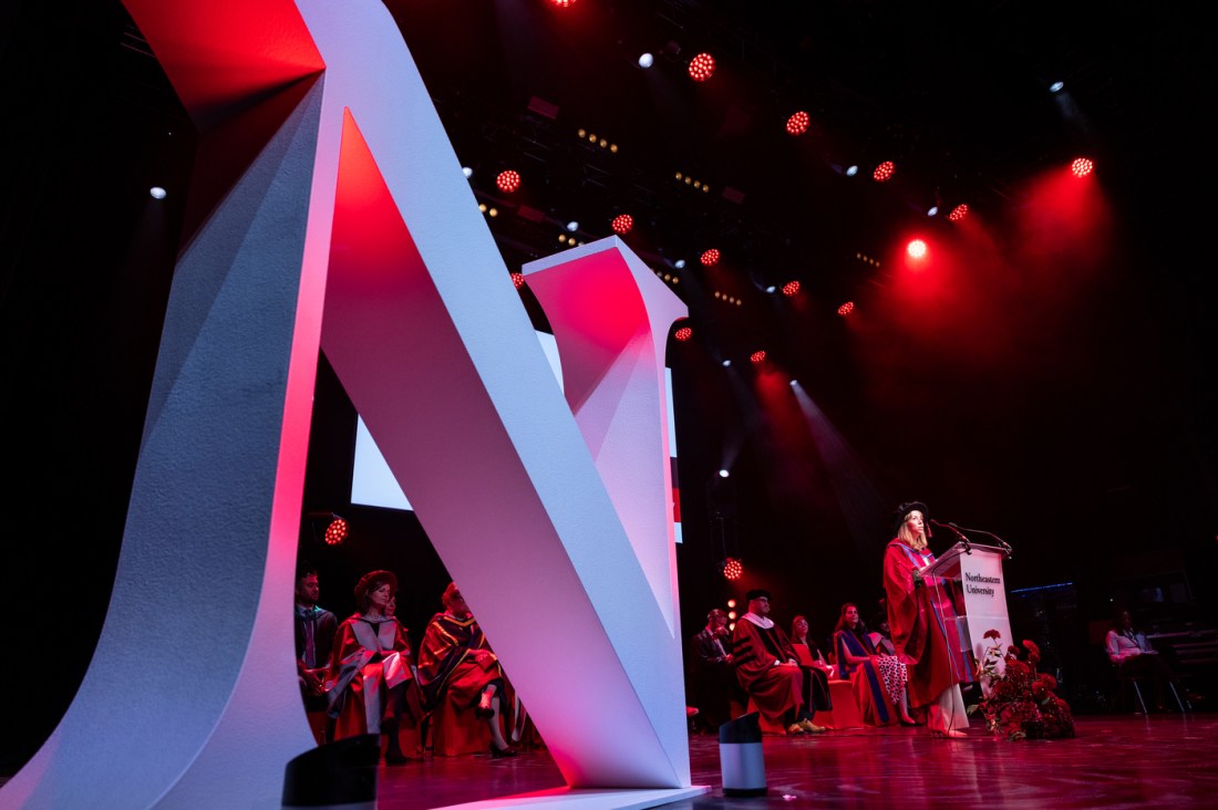 The Northeastern logo depicted on stage during the London Convocation.