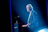 Dutch politician Geert Wilders standing at a podium and speaking during the Danish People&#039;s Party annual meeting.